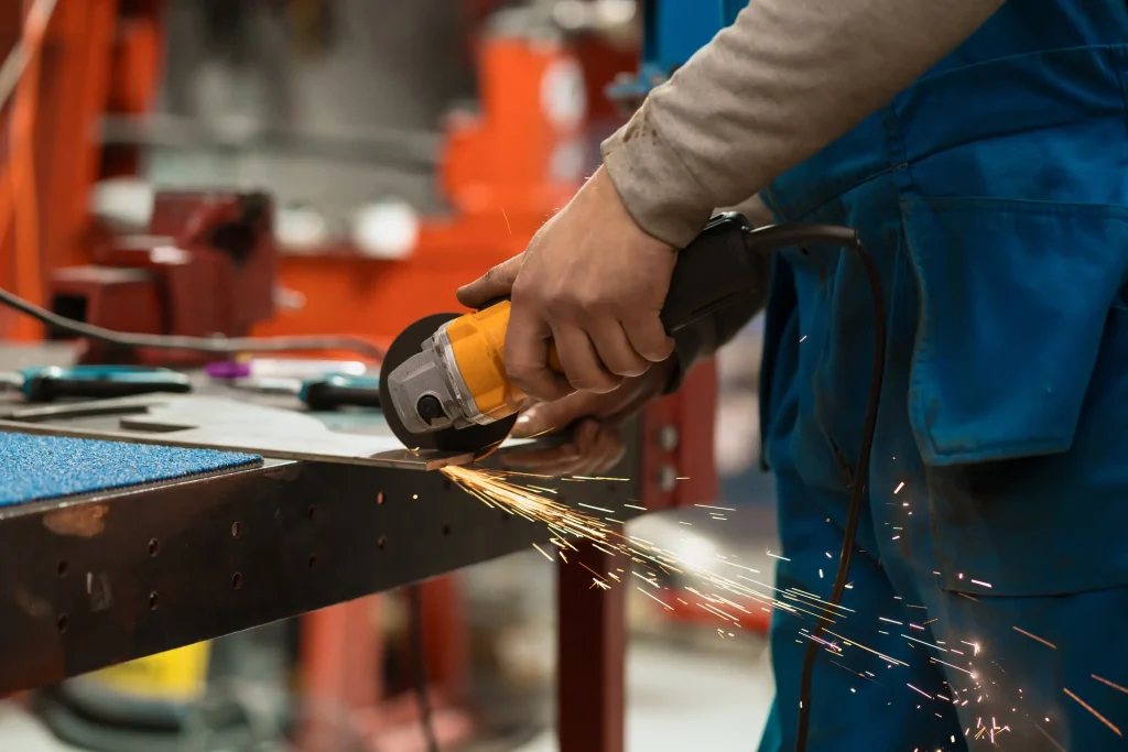 worker-working-with-circular-grinder-metal-with-sparks