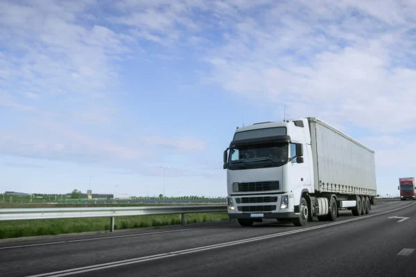 speeding-white-semi-truck-with-cargo-trailer-drives-highway-truck-is-first-column-heavy-vehicles-sun-is-shining speeding-white-semi-truck-with-cargo-trailer-drives-highway-truck-is-first-column-heavy-vehicles-sun-is-shining