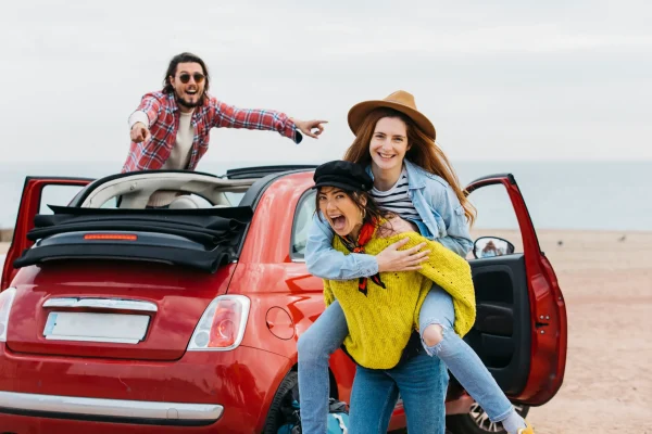 woman-holding-back-happy-lady-near-man-leaning-out-from-car woman-holding-back-happy-lady-near-man-leaning-out-from-car