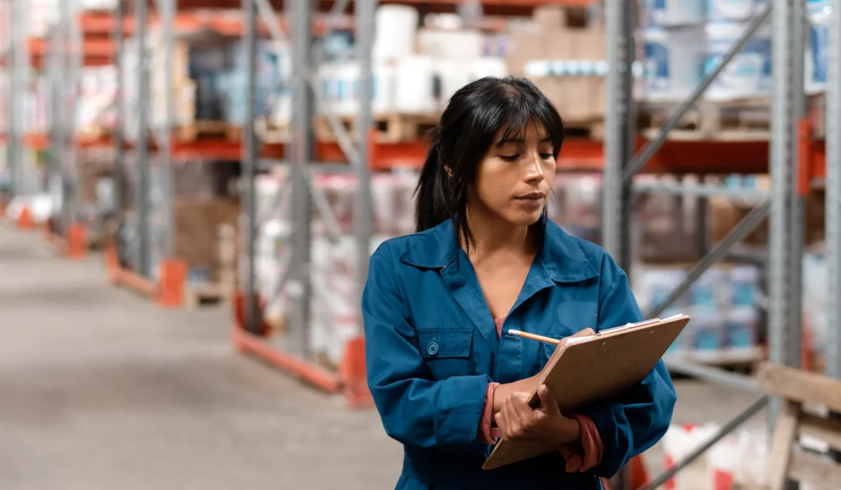 woman-worker-taking-notes-warehouse